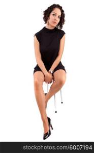 Beautiful woman sitting on a chair, isolated