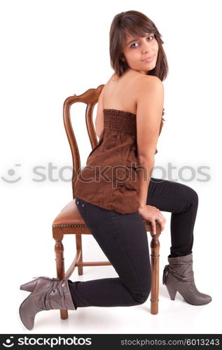 Beautiful woman sitting on a chair, isolated