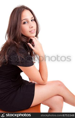 Beautiful woman sitting on a chair, isolated
