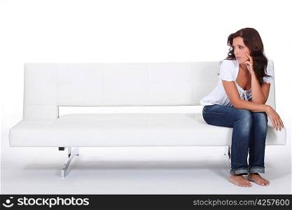 beautiful woman sitting on a couch