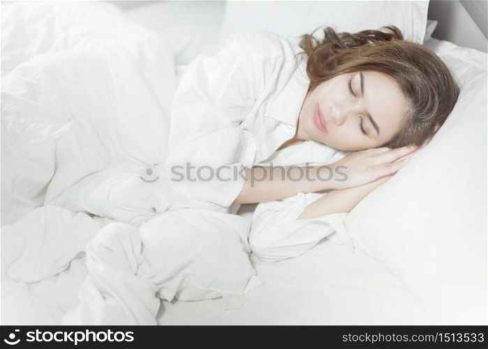 Beautiful woman sleeping on bed