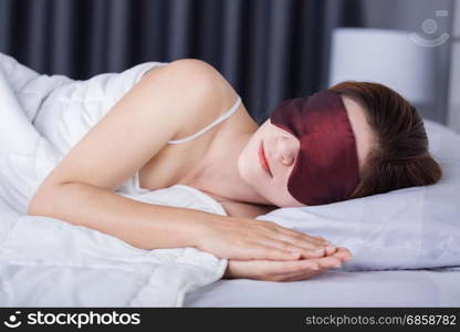 beautiful woman sleeping on bed with eye mask