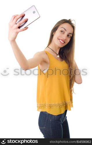 Beautiful woman smiling and taking a selfie, isolated over a white background