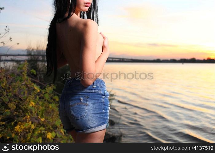 Beautiful woman standing on at the beach