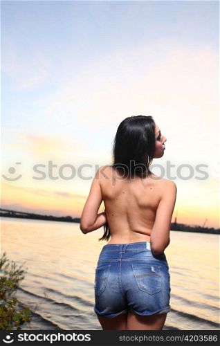 Beautiful woman standing on at the beach