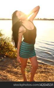 Beautiful woman standing on at the beach