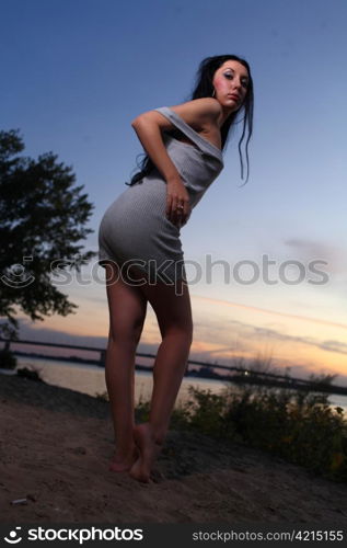 Beautiful woman standing on at the beach