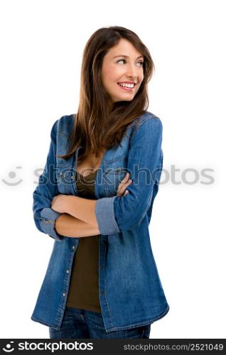 Beautiful woman standing over a white background and lokking to the side and lauthing. Happy woman