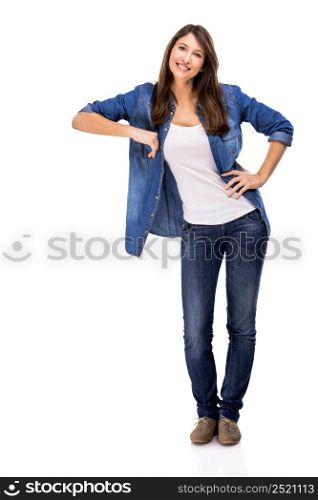 Beautiful woman standing over a white background with copyspace for the designer. Woman showing something