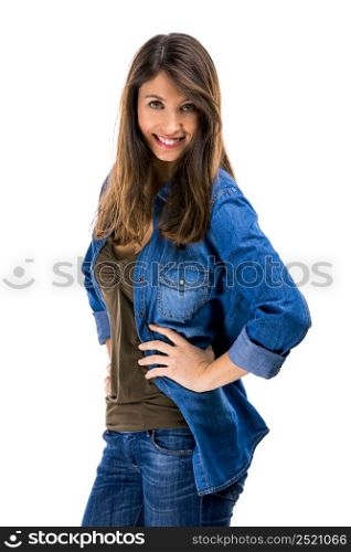 Beautiful woman standing over a white background with hands on the hips and smiling. Beautiful woman