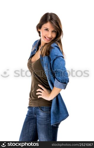 Beautiful woman standing over a white background with hands on the hips and smiling. Beautiful woman posing