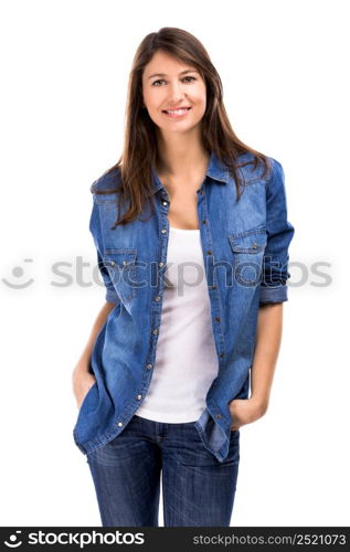 Beautiful woman standing over a white background with hands on the pockets and smiling. Beautiful woman smiling