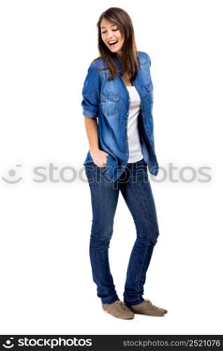 Beautiful woman standing over a white background with hands on the pockets and smiling. Beautiful woman smiling