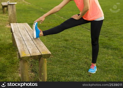 Beautiful woman stretching her muscles after finish the workout