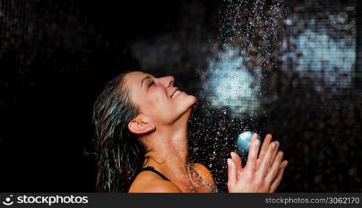 Beautiful Woman Taking a Shower after Spa Center Sauna.. Beautiful Woman Taking a Shower