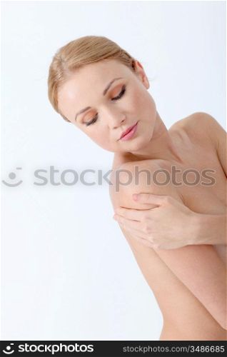Beautiful woman taking care of her skin