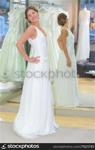 beautiful woman trying a wedding dress