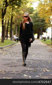 Beautiful woman walking in park