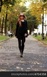 Beautiful woman walking in park
