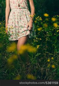 Beautiful woman walks at the country. Casual dress, barefoot.