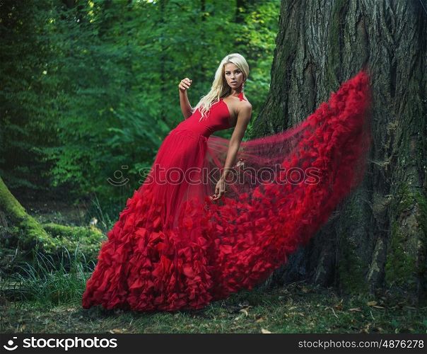Beautiful woman wearing an amazing red dress