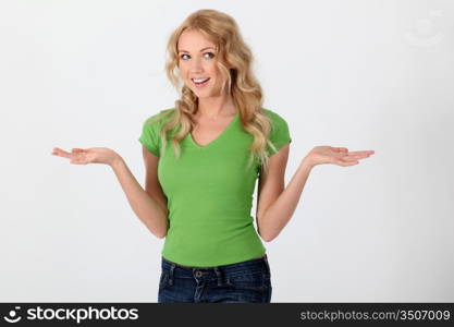 Beautiful woman wearing green shirt with surprised look