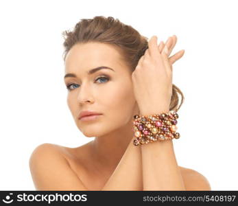 beautiful woman wearing hand jewelry with beads