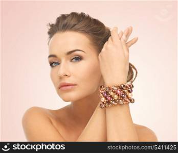 beautiful woman wearing hand jewelry with beads