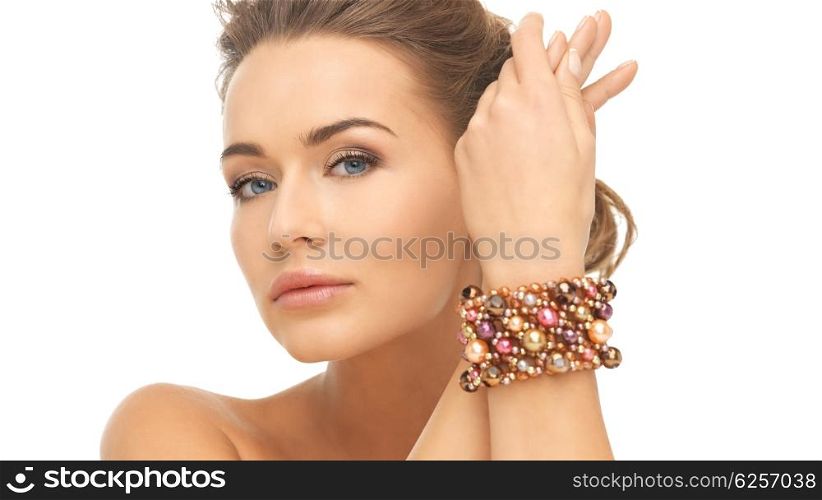 beautiful woman wearing hand jewelry with beads. woman wearing bracelet with beads