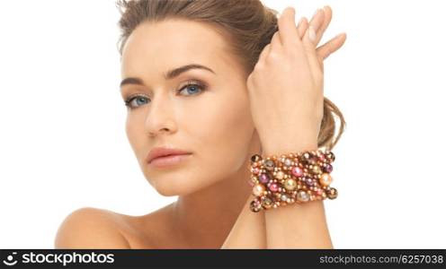 beautiful woman wearing hand jewelry with beads. woman wearing bracelet with beads