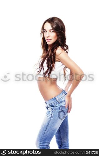 beautiful woman wearing jeans holding her butt. beautiful woman wearing jeans holding her butt on white background