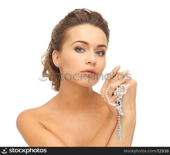 beautiful woman wearing pearl earrings and necklace