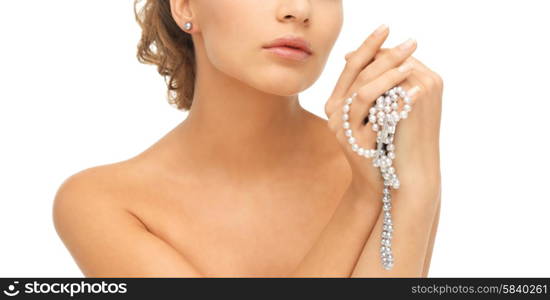 beautiful woman wearing pearl earrings and necklace. woman with pearl earrings and necklace