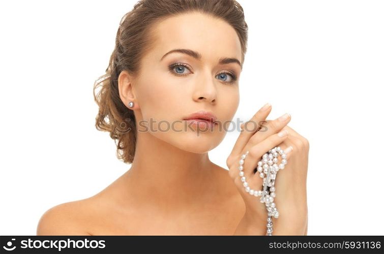 beautiful woman wearing pearl earrings and necklace. woman with pearl earrings and necklace