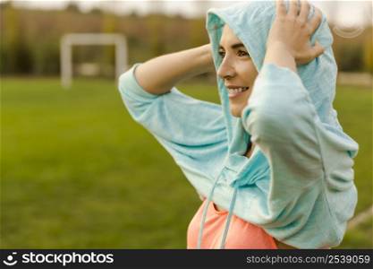 Beautiful woman wearing something warm after exercise