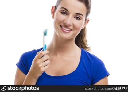 Beautiful woman with a great smile holding toothbrush, isolated over a white background