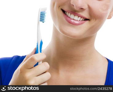 Beautiful woman with a great smile holding toothbrush, isolated over a white background