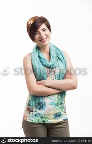 Beautiful woman with a modern hair cut, standing over a white background