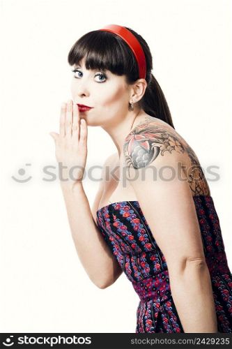 Beautiful woman with a vintage look posing, isolated over a white background