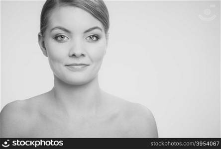 Beautiful woman with bare shoulders. Beautiful woman with bare shoulders. Attractive girl with perfect clean skin. Black and white photo.