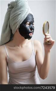 Beautiful woman with Black facial mask, Lifestyle concept