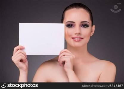 Beautiful woman with blank message paper