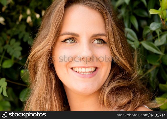 Beautiful woman with blue eyes on a sunny day outside