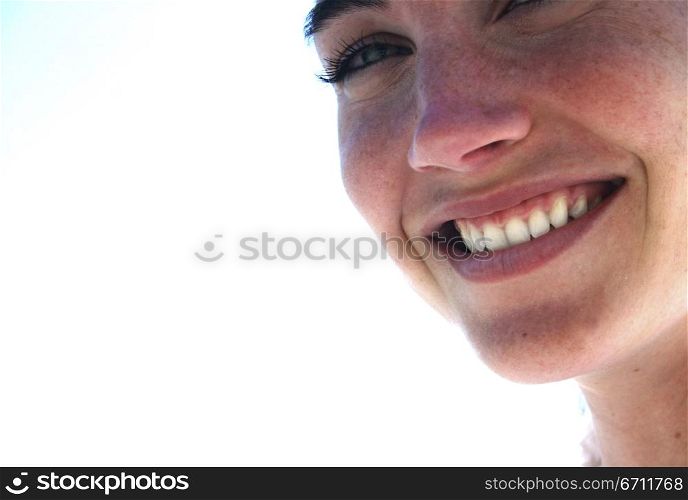 Beautiful woman with blue eyes smiles