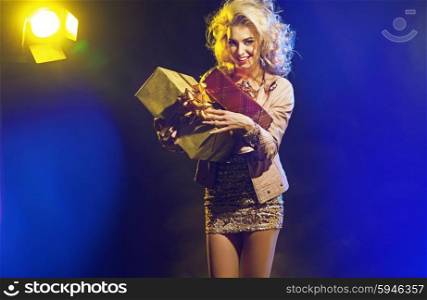 Beautiful woman with bunch of presents