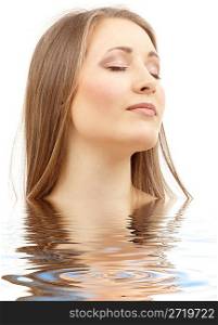 beautiful woman with closed eyes in water