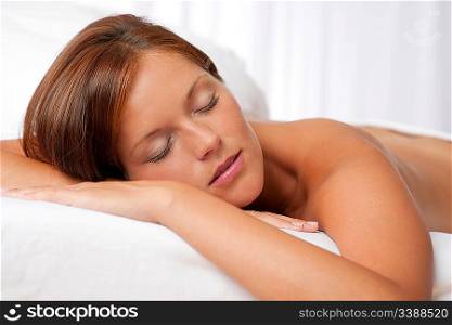 Beautiful woman with closed eyes waiting for spa treatment