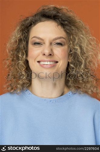 beautiful woman with curly blonde hair smiling 2