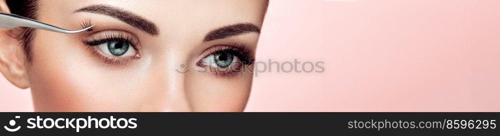 Beautiful Woman with Extreme Long False Eyelashes. Eyelash Extensions. Makeup, Cosmetics. Beauty, Skincare. Woman Glues Eyelashes