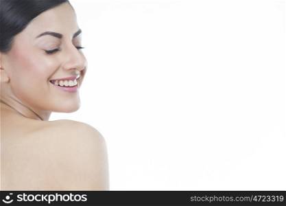 Beautiful woman with eyes closed smiling